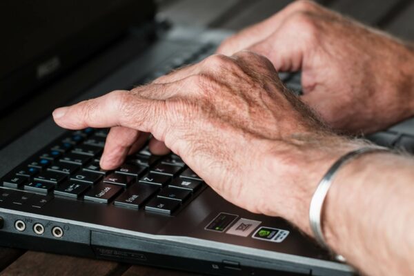 old man typing